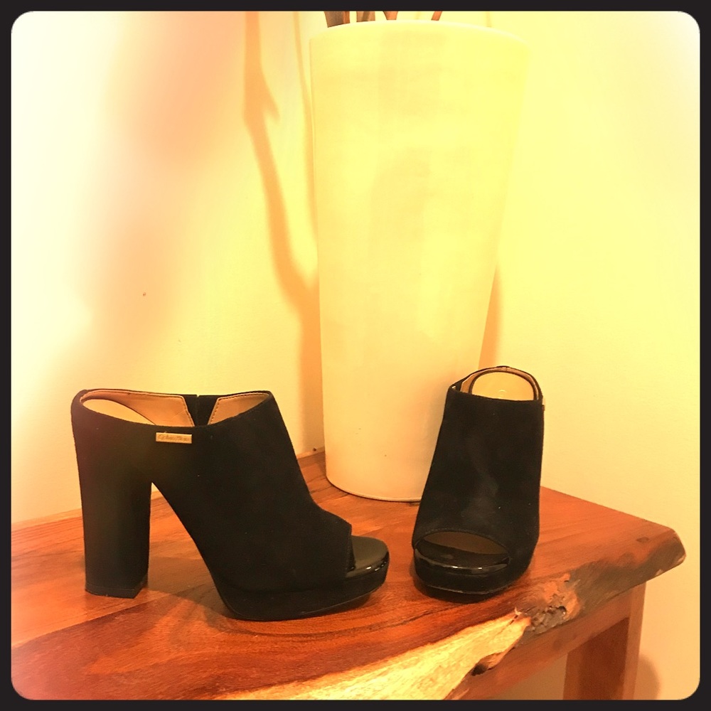 Black suede platform Calvin Klein bootie.